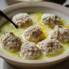 Meatball soup in a bowl with a spoon