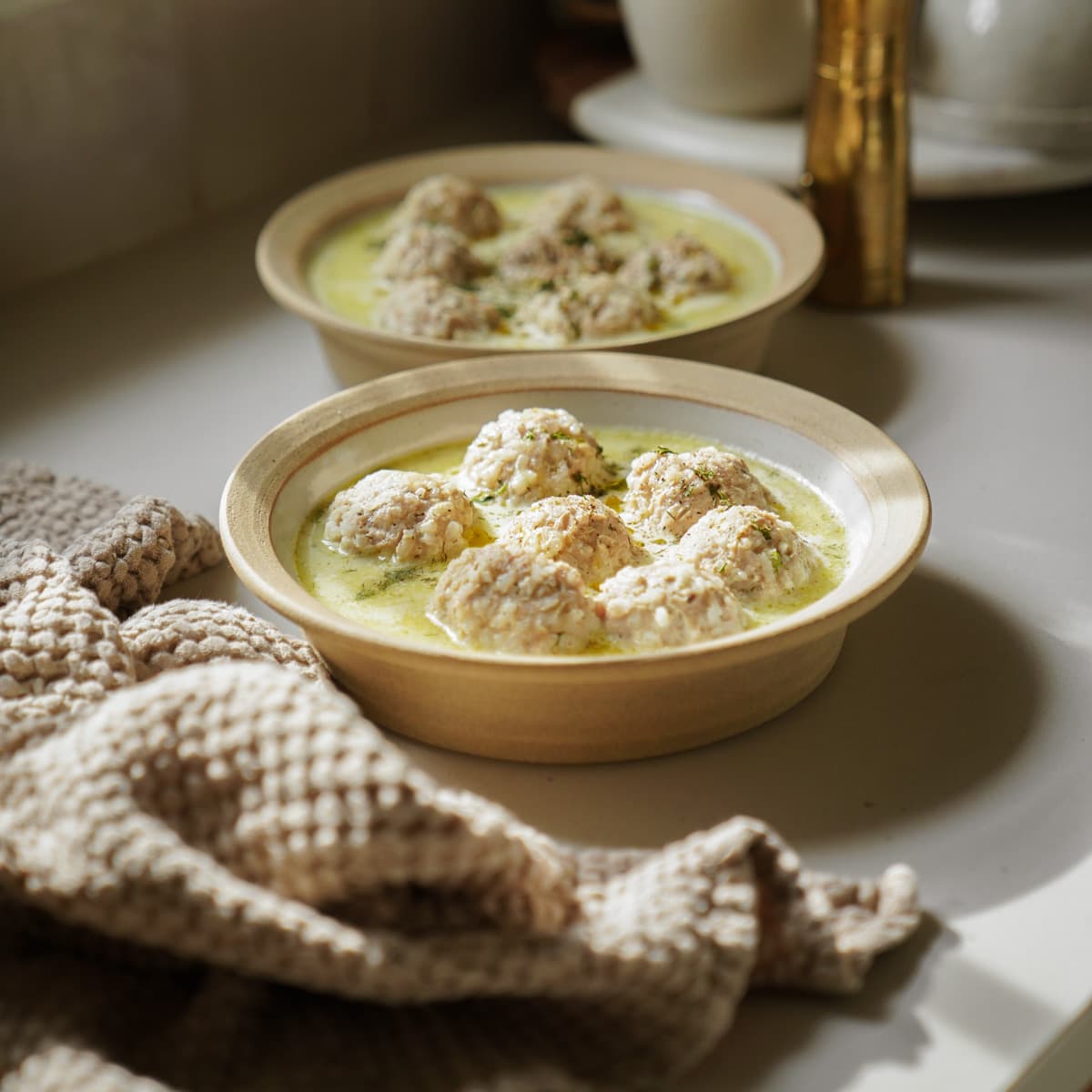 Meatball soup in 2 bowls 