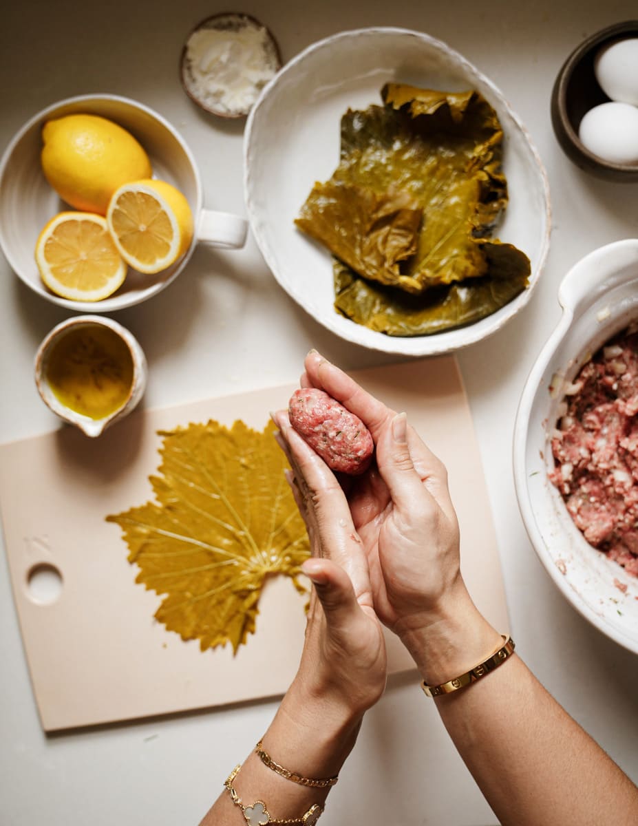 Rolling dolmades mixture into rolls