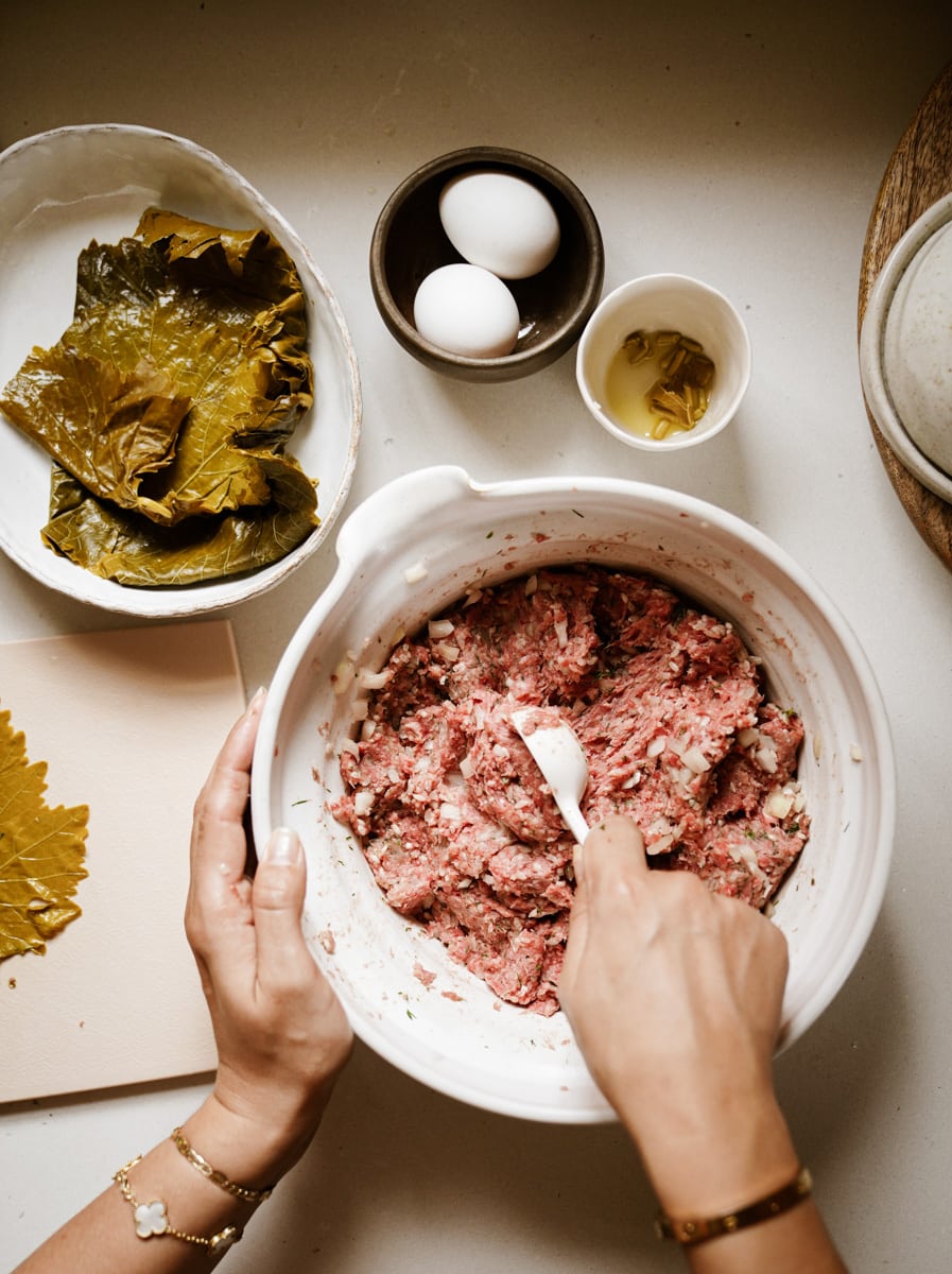 Mixing dolmades filling