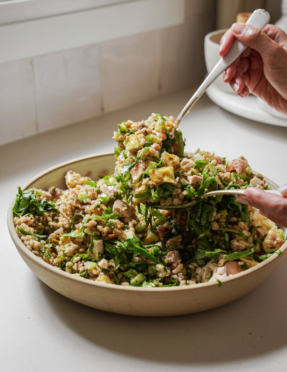 Mixing up Bulgar Salad in a bowl