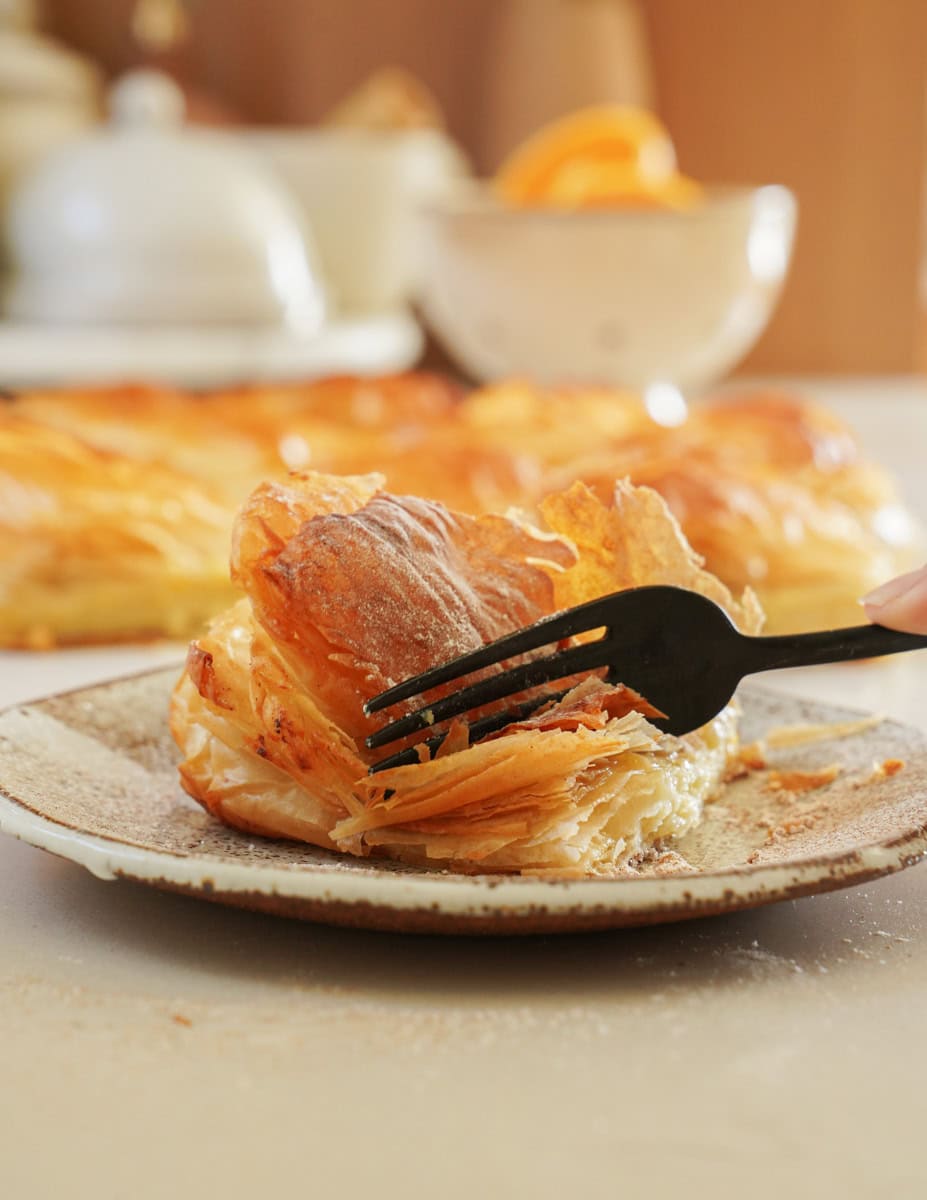 Fork cutting into Bougatsa