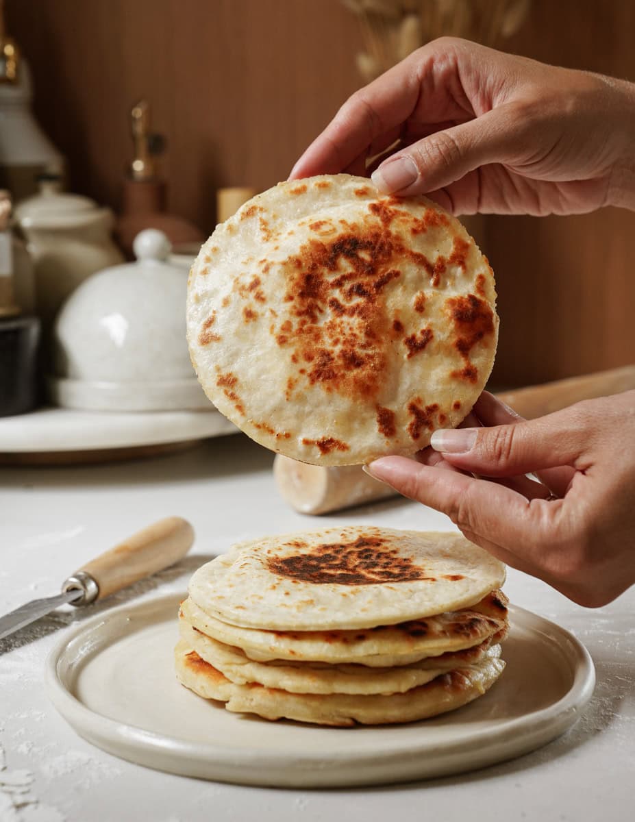 Stack of pita pockets on a plate