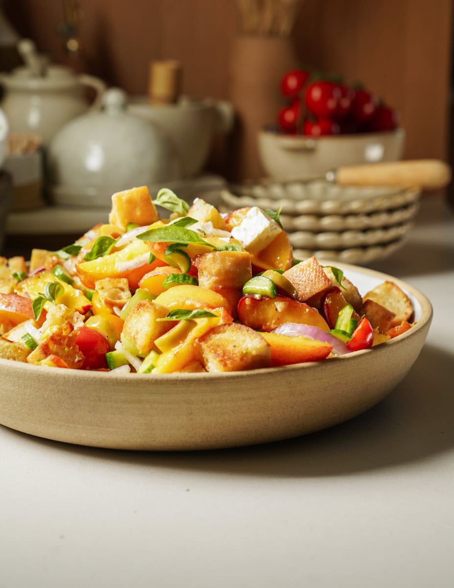 Bowl of peach salad on counter