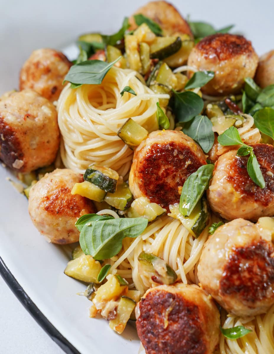 Shrimp balls on a plate of pasta